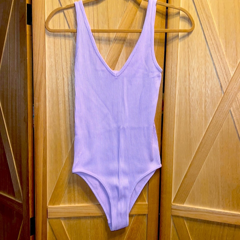Brand new lavender Aura bodysuit, soft to the touch, ribbed material.